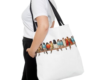 May include: A white tote bag with black straps featuring a colorful illustration of a row of birds perched on a branch.
