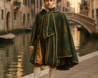 May include: A green and gold Renaissance-style costume featuring a cape, jacket, and breeches. The outfit has gold trim and a floral pattern. The breeches are a contrasting tan color. The person is wearing white stockings and black shoes.
