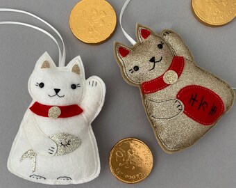 Maniko Neko White & Gold Japanese Lucky Cats, set of two hanging decorations, with golden carp.