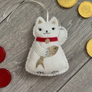 Maniko Neko White Japanese Lucky Cat hanging decoration, with golden carp.