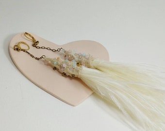 Bohemian wedding dangle earrings in vintage ivory sari silk with ostrich feathers and beads. Handcrafted wedding jewelry.