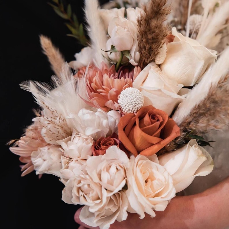 An elegant wedding bouquet in shades of terra cotta, rust, ivory, blush pink is inspiration for this couples' one year anniversary ornament.  Buyers are able to design their 1st anniversary ornament by choosing from 32 custom color paper flowers, shown in a future photo.