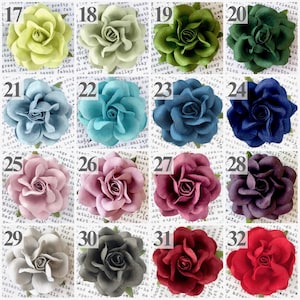 A color chart with 16 colored paper roses in shades of spring green, mint, moss, emerald, dusty blue, cornflower, french blue, peacock, navy, lavender, wisteria, plum, silver, gray, burgundy, wine, and ruby red.  Clients can choose up to 4 flower colors to design their four year anniversary flower theme ornament.