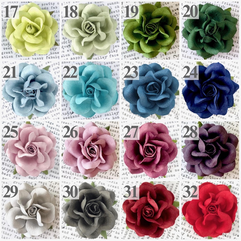 A color chart with 16 colored paper roses in shades of spring green, mint, moss, emerald, dusty blue, cornflower, french blue, peacock, navy, lavender, wisteria, plum, silver, gray, burgundy, wine, and ruby red.  Clients can choose up to 4 flower colors to design their four year anniversary flower theme ornament.