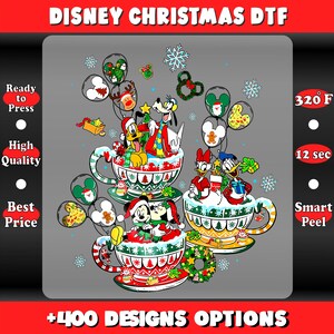 May include: A festive Disney Christmas DTF design featuring Mickey, Minnie, Donald, Daisy, Goofy, and Pluto in teacups. The design includes snowflakes, Christmas trees, and balloons with character faces. The text "DISNEY CHRISTMAS DTF" is at the top.