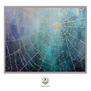 May include: Abstract painting of a spider web with gold lines on a blue and teal background. The artwork has a textured appearance with small white dots scattered throughout. The painting is framed with a neutral-toned border.