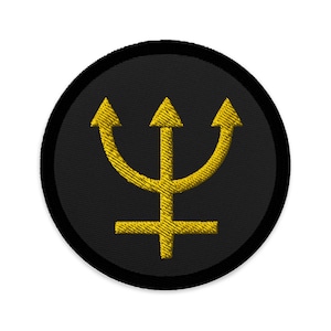 May include: A black and gold embroidered patch featuring a trident with a cross at the base. The patch is circular and has a black border.
