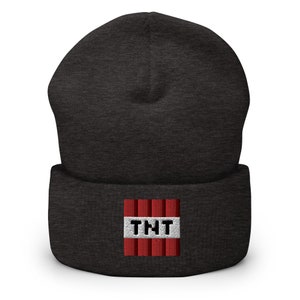 May include: A dark gray beanie with a red and white TNT block design embroidered on the front.