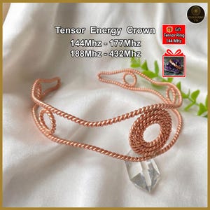 May include: A copper-colored Tensor Energy Crown with a clear crystal pendant. The crown features a twisted wire design with circular and looped accents. Text on the image reads "Tensor Energy Crown" and frequency ranges.