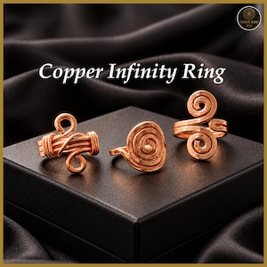 May include: Three copper rings with distinct wire-wrapped designs. The left ring features a multi-strand band with looped ends, the center ring has a flat spiral face, and the right ring displays a double-spiral motif. Text reads Copper Infinity Ring.
