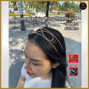May include: A copper Tensor Ring headband is worn on a person's head. The headband has a twisted rope design. The image also includes the text "144MHz" and "432MHz". A gift box with a Tensor Ring is also shown.