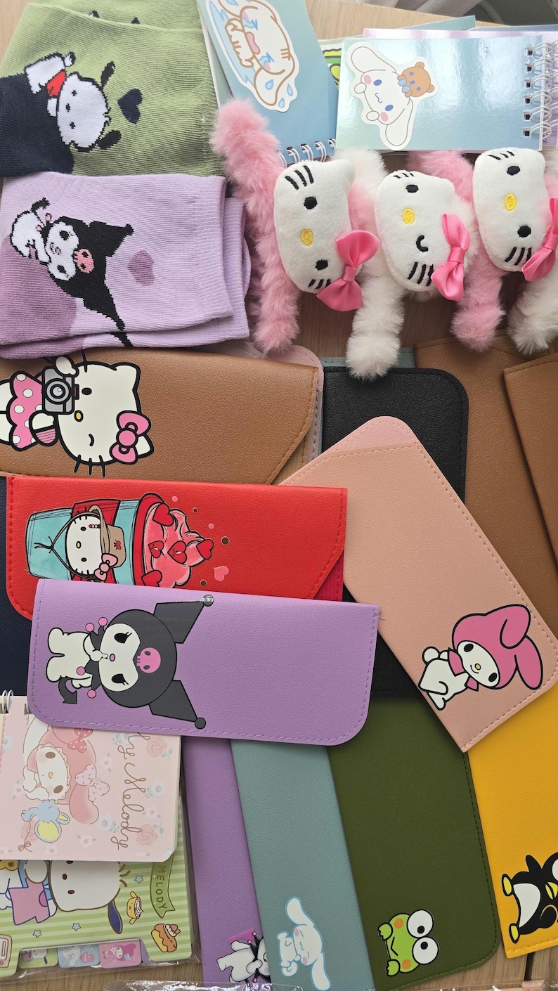 May include: An assortment of colorful Sanrio character-themed accessories, including socks, plush toys, notebooks, and eyeglass cases. The items feature characters like Hello Kitty, My Melody, and Kuromi, in various colors and designs.