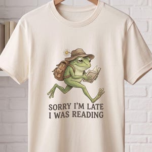 Maglietta con rana che corre e legge, maglietta divertente per amanti dei libri, regalo per lettori appassionati, maglietta per compleanno per topi di biblioteca e bibliotecari.