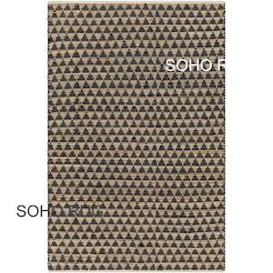 May include: A rectangular rug with a repeating pattern of black triangles on a beige background. The rug has a woven texture and the text "SOHO RUGS" is visible on the rug.