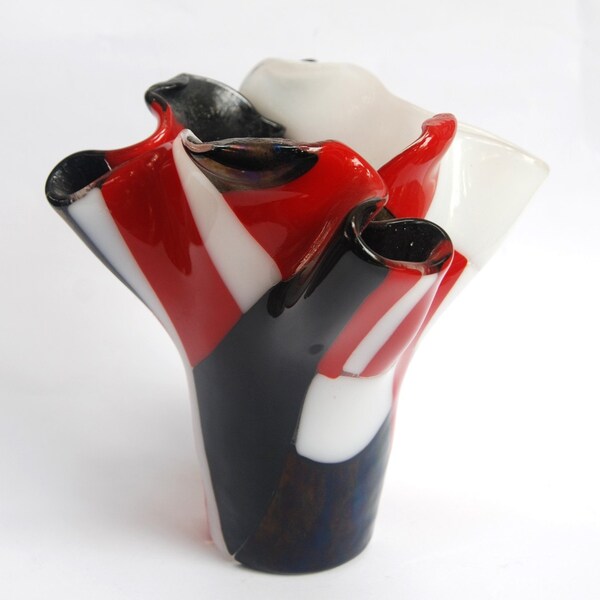 A red, white and black glass vase handmade by dalit glass