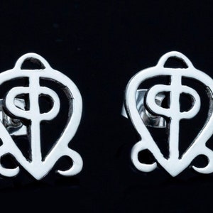 May include: A pair of silver earrings featuring a stylized Adinkra symbol, the Sankofa, which represents the importance of learning from the past.