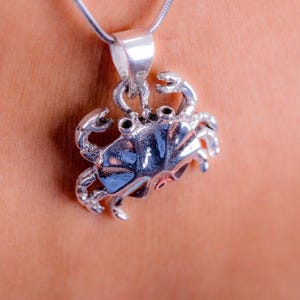 Silver crab pendant, thin sturdy chain. The pendant is detailed, showing the texture of the crab&#39;s shell and legs, Handmade nautical gift