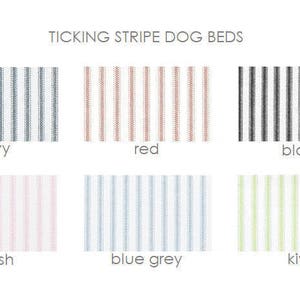 May include: Ticking stripe dog beds in navy, red, black, blush, blue grey, and kiwi.