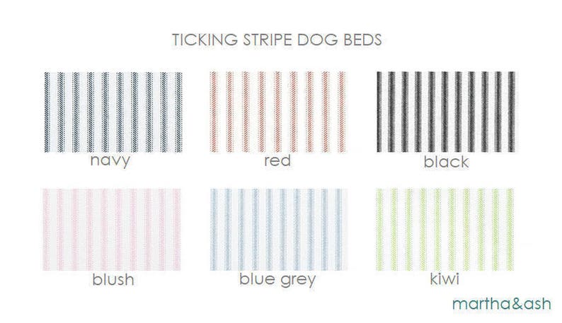 May include: Ticking stripe dog beds in navy, red, black, blush, blue grey, and kiwi.