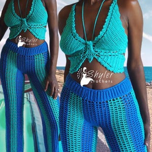 May include: A turquoise crochet halter top with a bow detail and matching blue and turquoise striped crochet pants. The outfit is handmade and features a unique, open-weave design. The brand name "Shyler Crochets" is visible.