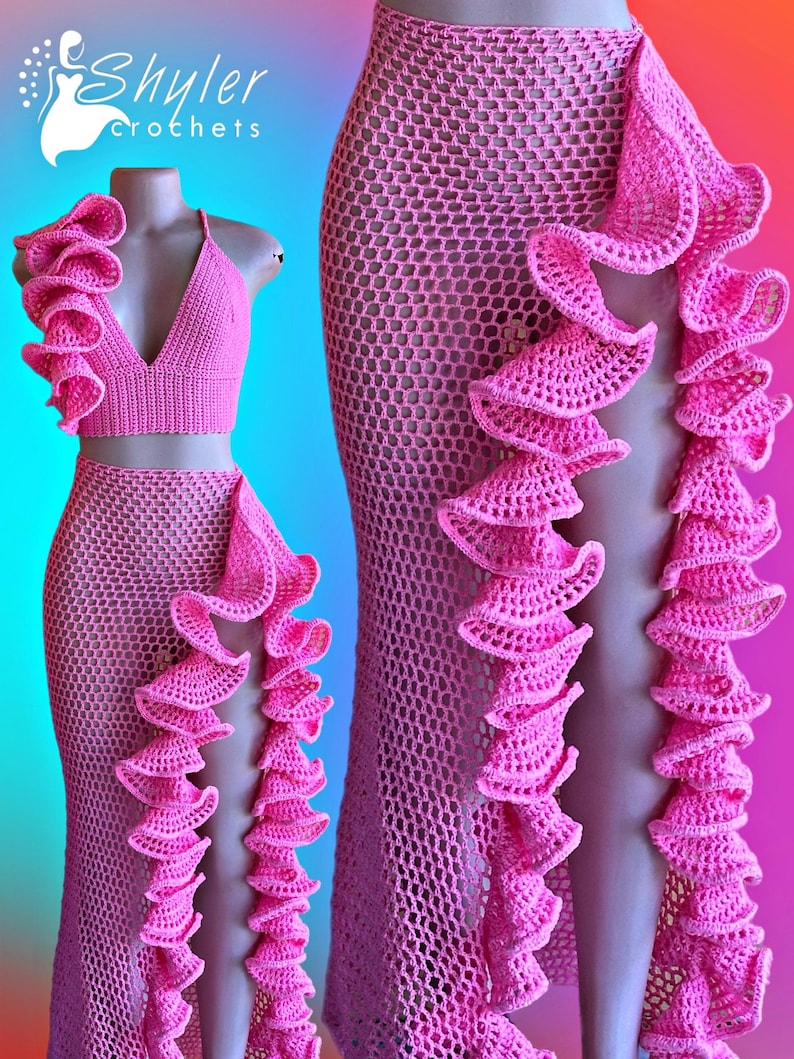 May include: Pink crochet two-piece set featuring a halter top and a high-waisted skirt, both adorned with ruffled trim. The set is displayed on a mannequin. The brand name "Shyler Crochets" is visible in the upper left corner.