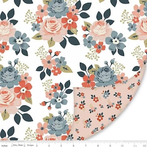 May include: Floral fabric with a white background, featuring a repeating pattern of roses, small flowers, and leaves in shades of pink, blue, and coral. The reverse side has a smaller floral pattern on a pink background. The fabric is measured in inches.