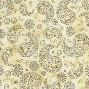 May include: A fabric with a repeating paisley pattern. The paisley shapes are filled with star designs in a light yellow color, outlined in dark brown. The background is a light beige color, creating a vintage aesthetic.