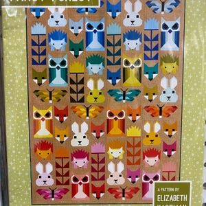 May include: A quilt pattern titled "Fancy Forest" featuring geometric animal designs, including foxes, owls, rabbits, and butterflies. The quilt measures 67" x 91" and 35" x 47". The pattern is by Elizabeth Hartman.