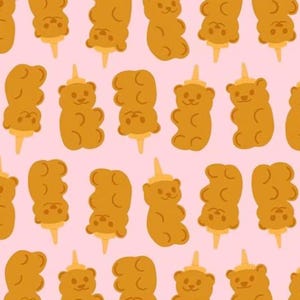 May include: A repeating pattern of cartoon gummy bears on a pale pink background. Each bear is a golden-brown colour and is depicted on a popsicle stick. The bears have a small, light-brown cone on their heads.
