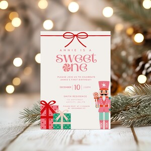 May include: A birthday invitation with a festive design. The text reads "Annie is a sweet one" with a candy cane graphic. Includes a nutcracker illustration, gift boxes, and RSVP information. The date is December 10th.