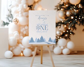 Feestbord Winter Onederland | Sneeuwvlok verjaardagsdecoratie | Bewerkbare canvassjabloon | Blauwe winterwelkomstposter | Teken eerste verjaardag