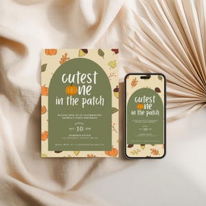 May include: An invitation and a smartphone displaying the same design. The design features the text "cutest one in the patch" with a pumpkin illustration, surrounded by fall leaves and acorns. The invitation is for a first birthday.