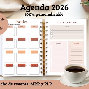 May include: Open planner with a gold spiral binding, featuring a layout for 2026. The pages include sections for planning, important dates, and tasks. A cup of coffee and a gold pen are on the side. Text on the image says "Agenda 2026" and "100% personalizable".