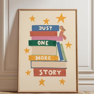 May include: A framed wall art print featuring a stack of colorful books with the text JUST ONE MORE STORY. A small brown mouse sits on the top book. The background is cream-colored and decorated with yellow stars scattered around the book stack.