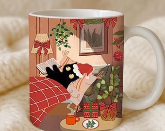 May include: White ceramic mug featuring a cozy Christmas scene. A black cat wearing a Santa hat is nestled under a red plaid blanket. The mug's design includes a Christmas tree, gifts, and a warm interior setting with a book and a cup of coffee.