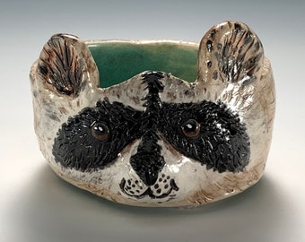 Raccoon Bowl hand sculpted from a lump of clay.