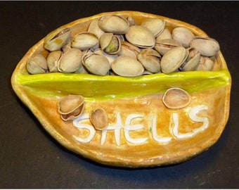 Extra large pistasicio nut dish handmade in US from a lump of clay.