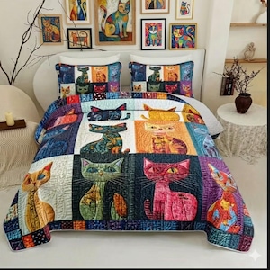 May include: A colorful quilt and pillow set featuring a patchwork design of stylized cats in various poses and colors. The quilt is displayed on a bed with matching pillowcases, and framed cat art hangs on the wall.