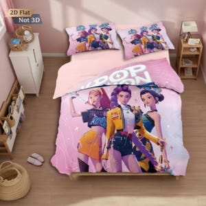 May include: Pink and white duvet cover set with a graphic of three animated women. The duvet cover and two pillowcases display the word "POP" and the image of the women. The text "2D Flat Not 3D" is in the upper left corner.