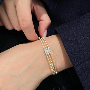 Armring i 18K guld med X-korsad diamant, armband med tre rader av kabeltråd, manschett med labodult diamant och korsad diamant, iögonfallande jubileumspresent till henne bild 3