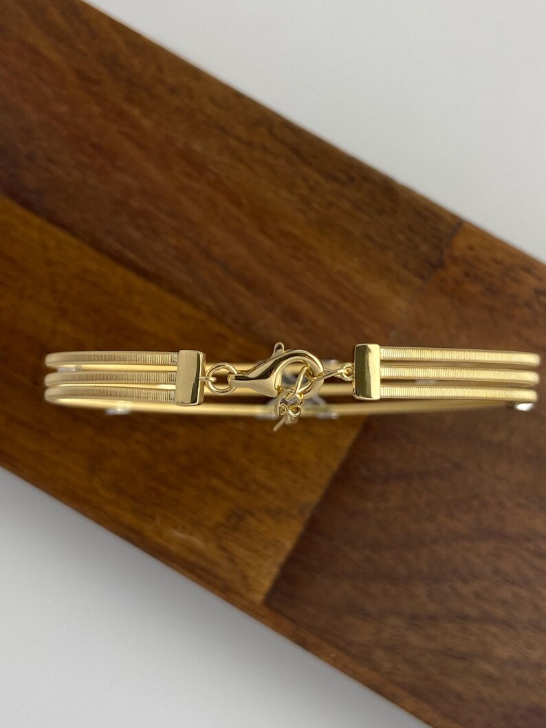 Armring i 18K guld med X-korsad diamant, armband med tre rader av kabeltråd, manschett med labodult diamant och korsad diamant, iögonfallande jubileumspresent till henne bild 6