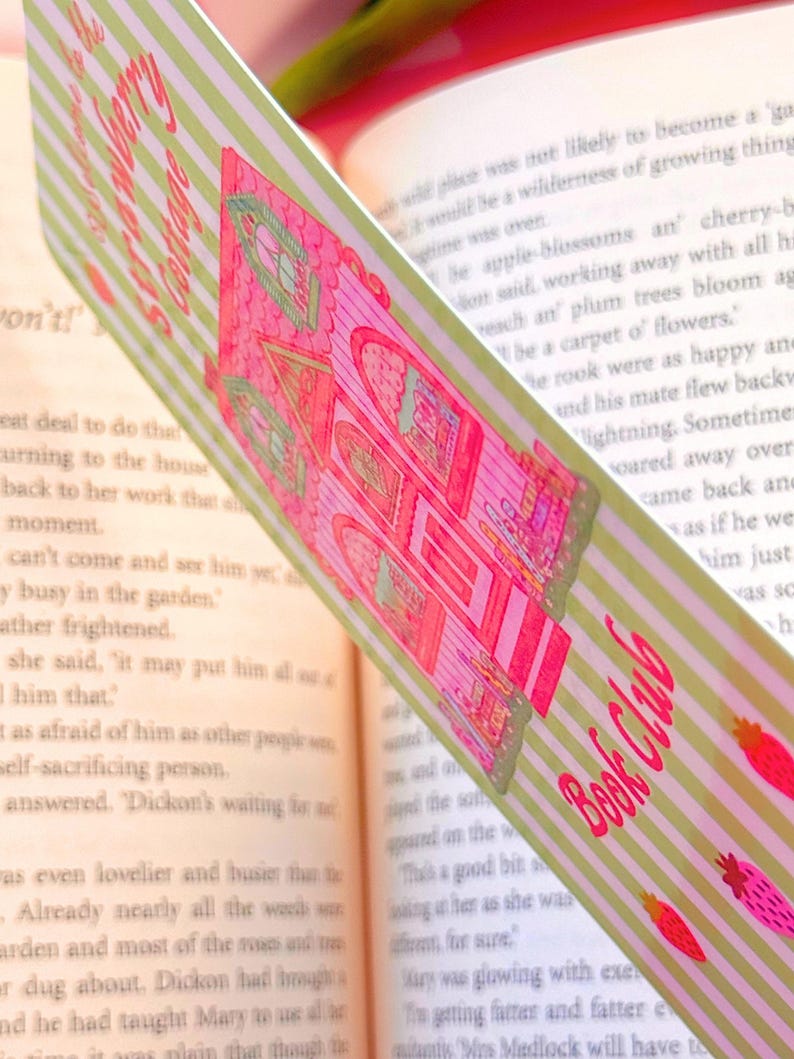 side view of the bookmark, size is wider at 3.5 inches by 6.5 inches, image is on both sides on thick paper with clear laminate