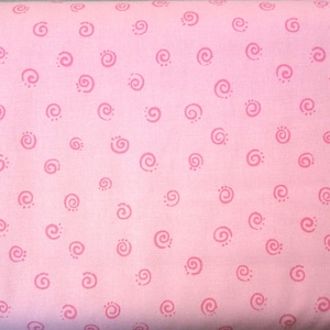 May include: Pink fabric with a repeating pattern of small pink swirls.