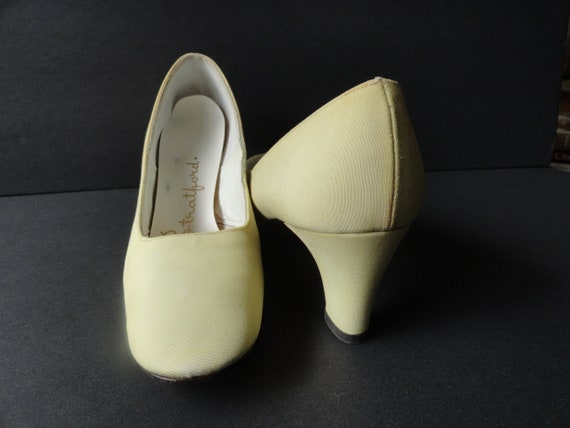 yellow shoes and clutch bag