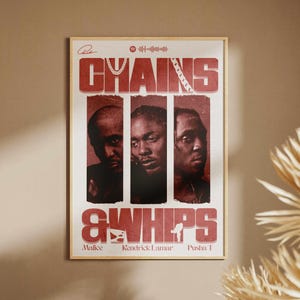 May include: A framed poster with a vintage aesthetic. The poster features three portraits of men in vertical panels, with the words "CHAINS & WHIPS" in bold red letters. The names "Malice," "Kendrick Lamar," and "Pusha T" are printed below.