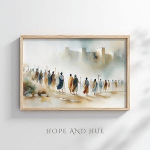 May include: Watercolor print in a light wooden frame. The artwork depicts a group of figures walking towards a castle in the distance. The figures are dressed in robes and carrying staffs. The color palette is soft, with muted tones of beige, brown, and blue. Text at the bottom reads "HOPE AND HUE".