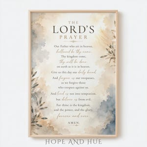 May include: A rectangular wall art print featuring The Lord's Prayer in dark brown serif and script typography. The background displays a soft watercolour wash in shades of beige, cream, and muted blue, accented by delicate botanical leaf illustrations.