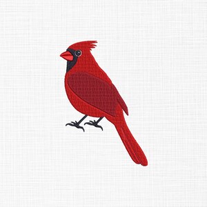 May include: A vibrant red cardinal bird embroidered on a white background. The bird features a black mask, beak, and feet, with a textured body. The cardinal is depicted in a side profile, showcasing its distinctive crest and long tail.