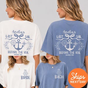 May include: White and blue t-shirts with nautical-themed graphics. The shirts feature text that reads "Amelia's Last Sail Before the Veil Bahamas 2026" and "The Bride" or "The Bach". The design includes an anchor, compass, and floral elements.