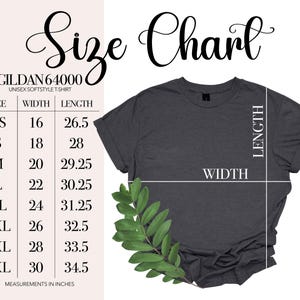 May include: A dark gray Gildan 64000 unisex softstyle t-shirt with a size chart. The chart lists sizes XS to 4XL, with corresponding width and length measurements in inches. A sprig of green leaves is in the lower left corner.